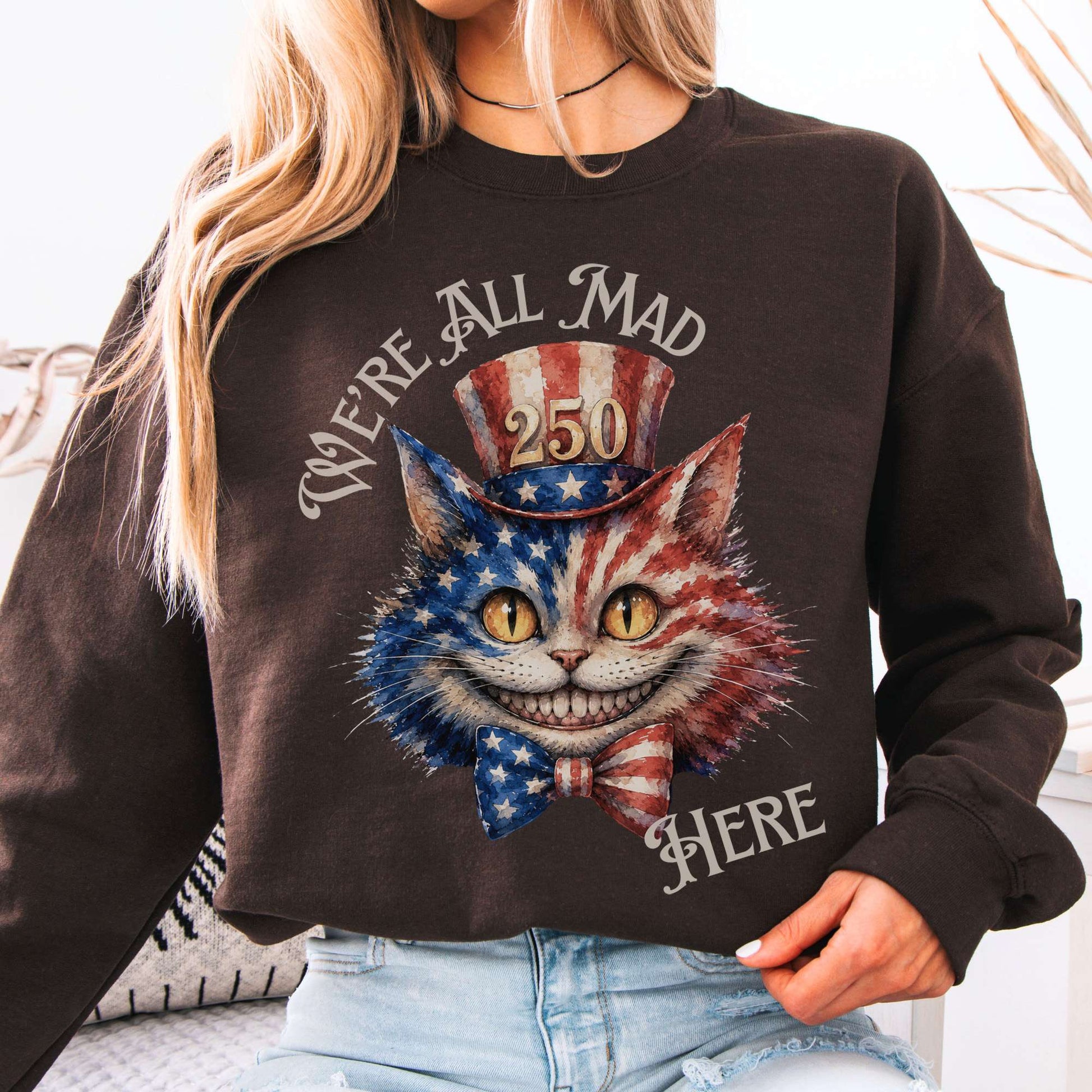 Sweatshirt Dark Chocolate / S We're All Mad Here America 250 Cheshire Cat Crewneck Sweatshirt The Mystic Eden