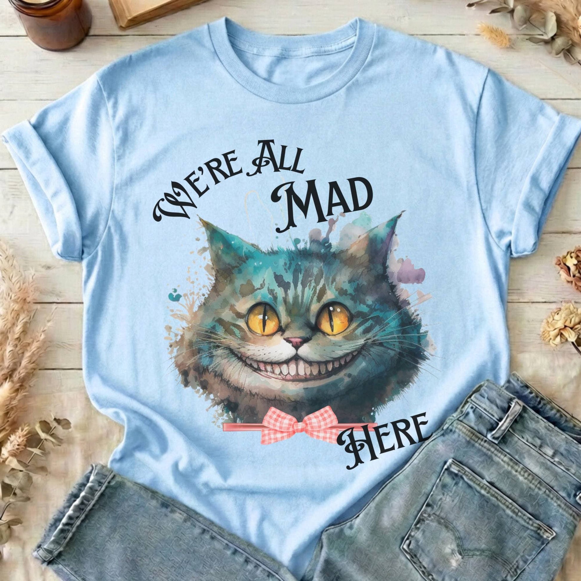 T-Shirt Light Blue / S We're All Mad Here Cheshire Cat T-Shirt The Mystic Eden