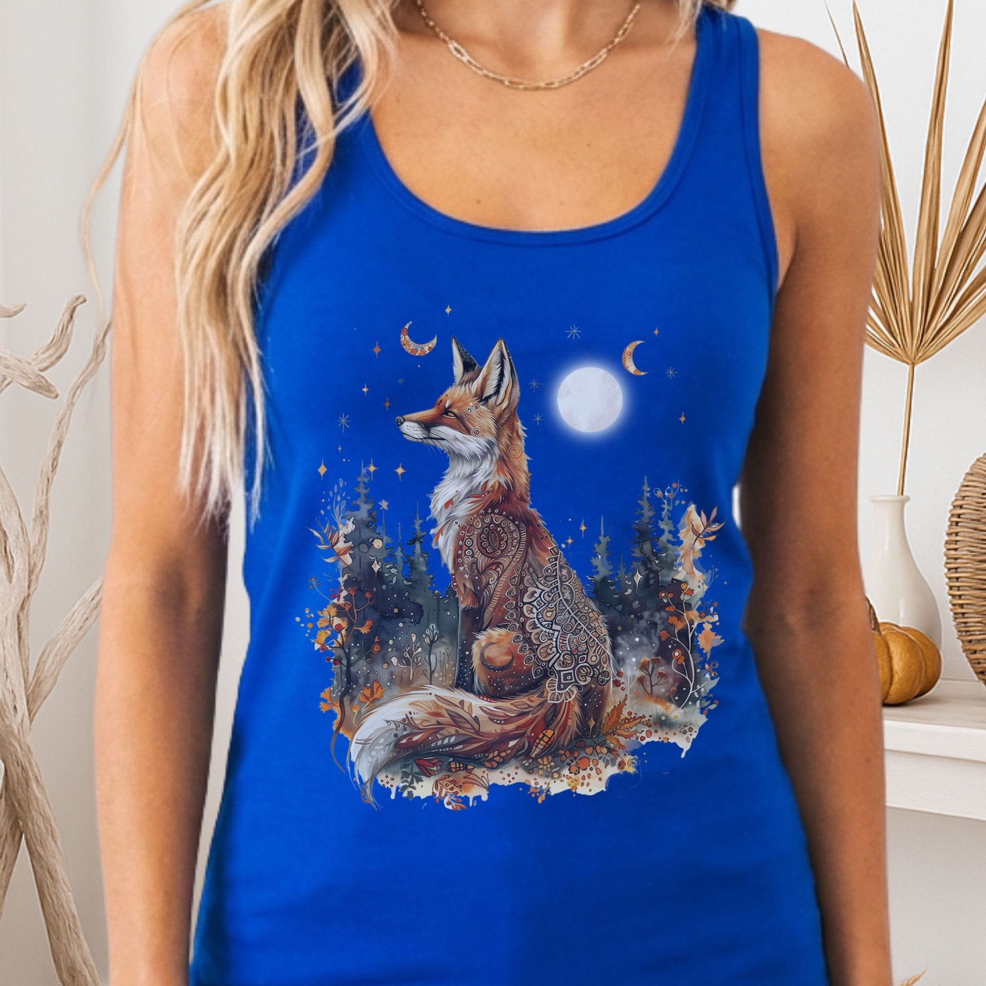Tank Tops Solid Royal / XS I don't see any text in the design.

Mystical Fox Night Scene Women's Lightweight Tank Top The Mystic Eden